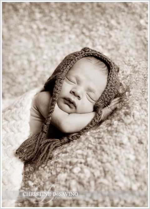 Sepia toned image of newborn with flyer hat - NJ Newborn Photographer