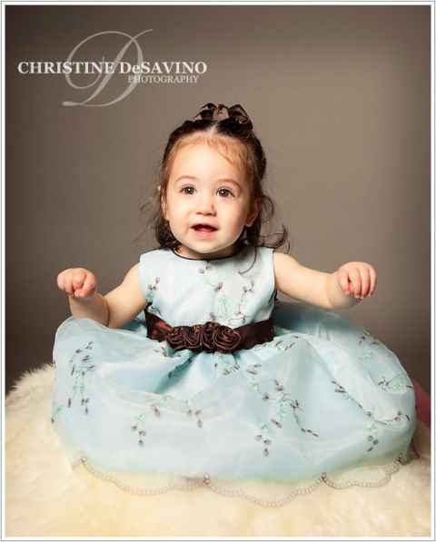 Child Portrait of a beautiful girl in an elegant blue dress