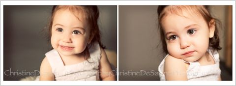 Portrait of a sweetly smiling little girl in a white lace dress