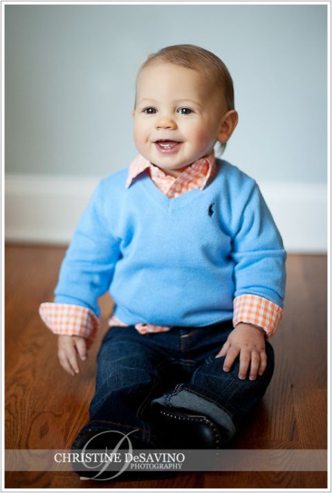 Boy in blue bedroom smiling - NJ Child Photographer