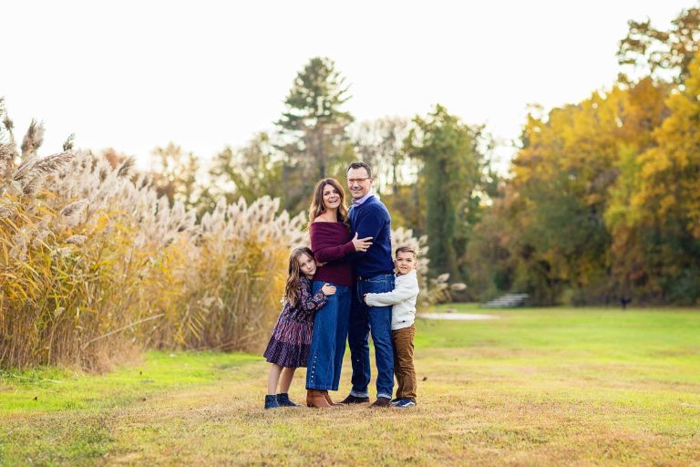 NJ Family photo shoot with fall foliage in the backgroun